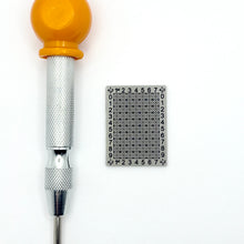 Load image into Gallery viewer, Automatic center punch beside a 12-word Compact Punchplate.
